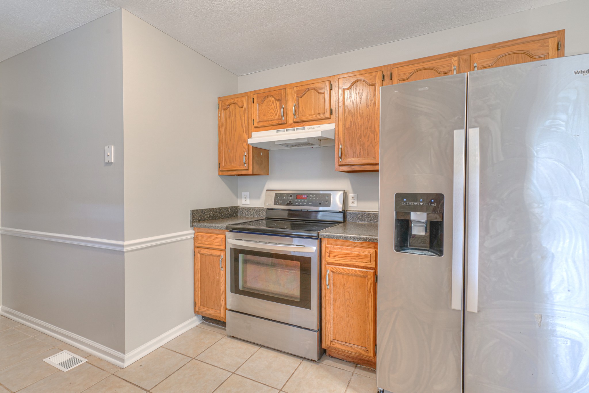 2426 Floyd Avenue Murfreesboro, TN 37127 - Photo 13 of 26 a kitchen with stainless steel appliances granite countertop a refrigerator and a stove