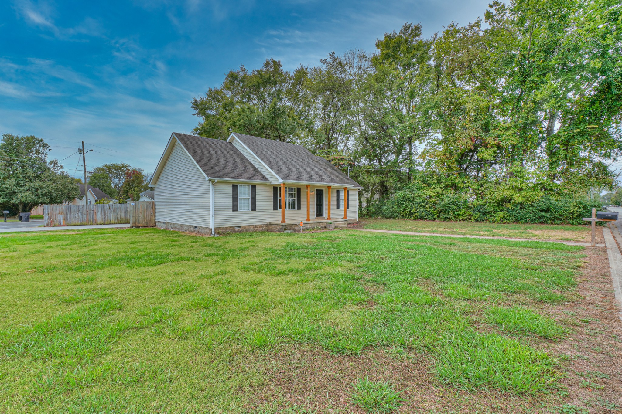 2426 Floyd Avenue Murfreesboro, TN 37127 - Photo 2 of 26 a aerial view of a house next to a yard with big trees