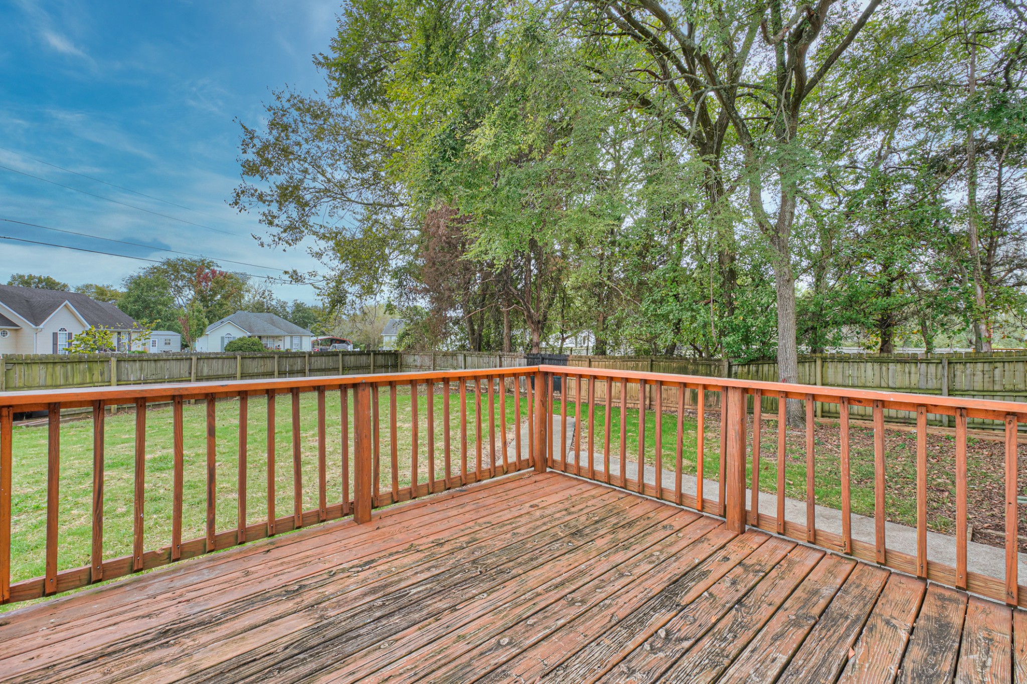 2426 Floyd Avenue Murfreesboro, TN 37127 - Photo 22 of 26 a balcony with wooden floor and fence