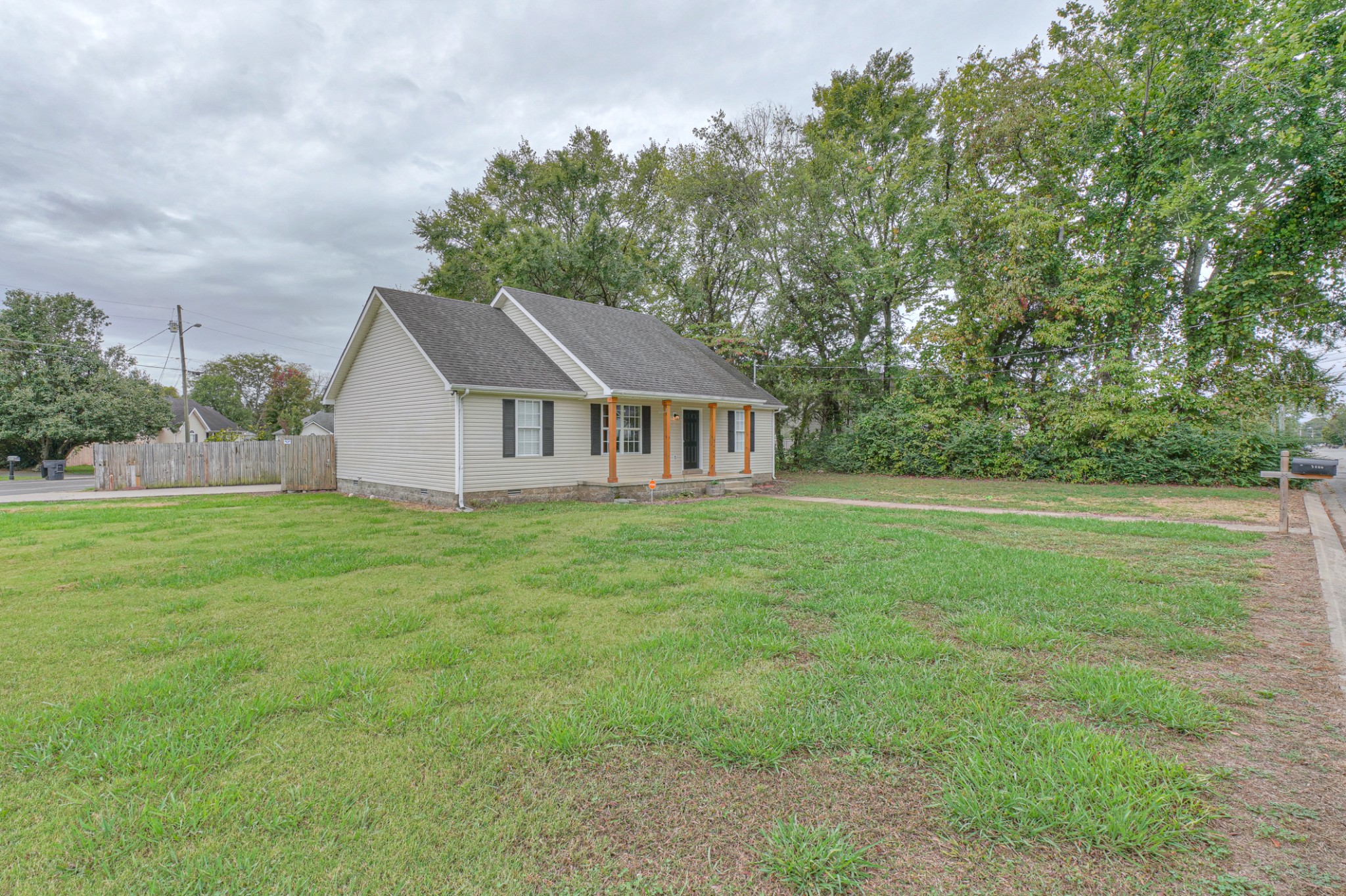 2426 Floyd Avenue Murfreesboro, TN 37127 - Photo 3 of 26 a aerial view of a house next to a big yard and large trees