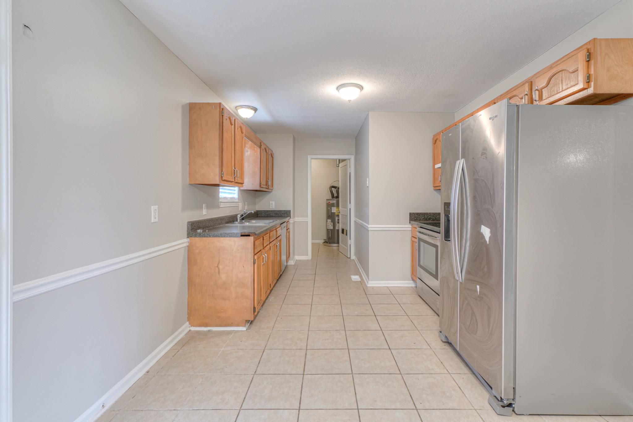 2426 Floyd Avenue Murfreesboro, TN 37127 - Photo 10 of 26 a kitchen with stainless steel appliances granite countertop a refrigerator and a stove