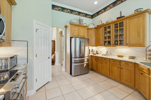 a living room with furniture fireplace and a large window