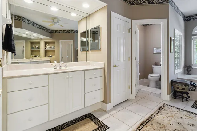 a view of staircase with white walls and a rug