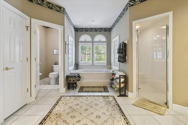 a balcony with table and chairs