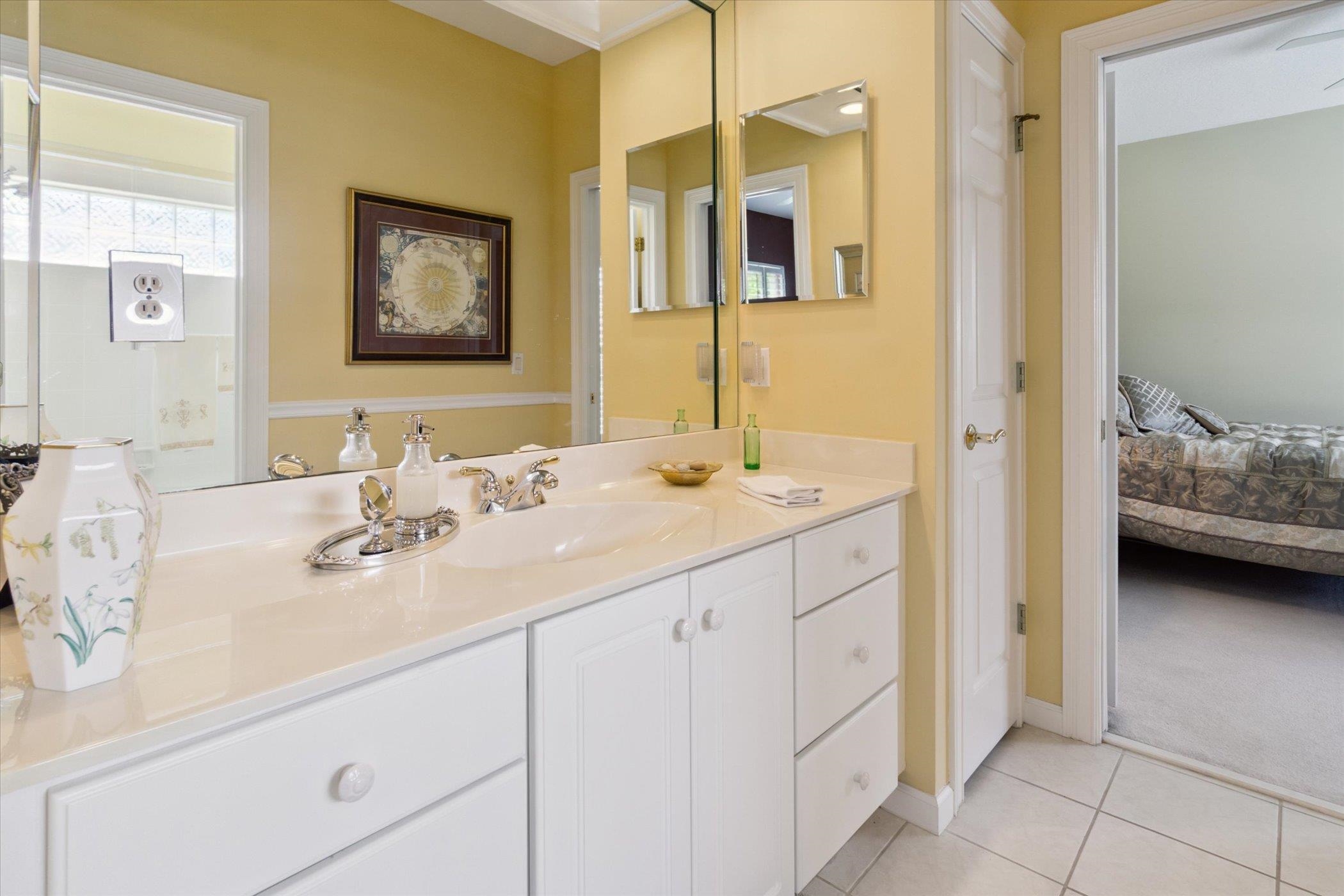 121 Marshside Drive St. Augustine, FL 32080 - Photo 39 of 71 a en suite bathroom with 2 sink tub and a mirror