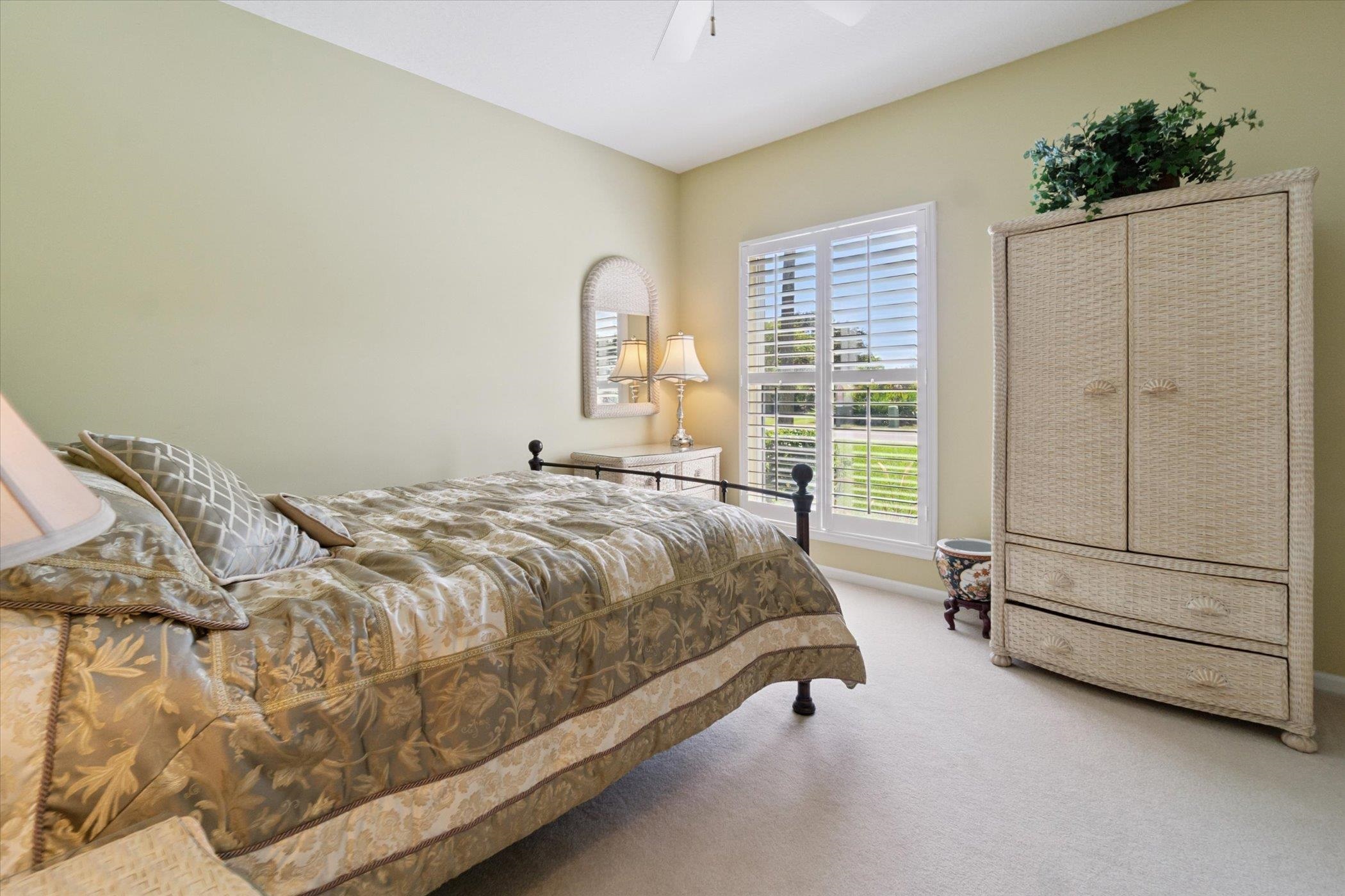 121 Marshside Drive St. Augustine, FL 32080 - Photo 41 of 71 a bed sitting in a spacious bedroom next to a window