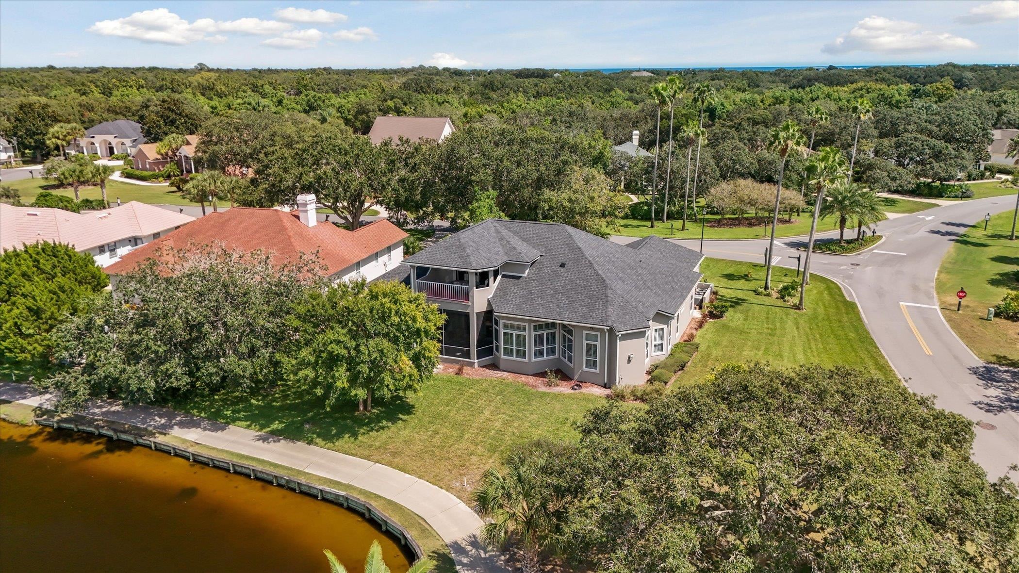 121 Marshside Drive St. Augustine, FL 32080 - Photo 59 of 71 an aerial view of a house with a garden and lake view