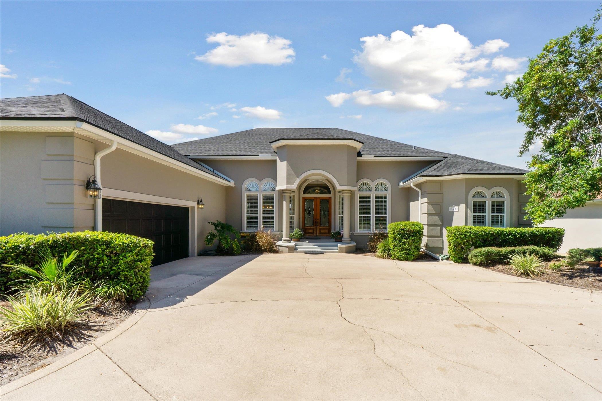 121 Marshside Drive St. Augustine, FL 32080 - Photo 7 of 71 a front view of a house with a yard