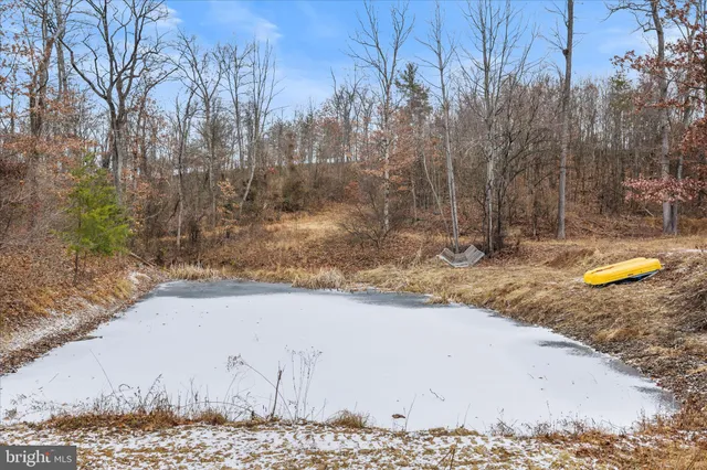 a view of a terrace with a table and chairs