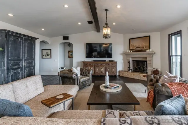 a dining room with furniture wooden floor and a rug