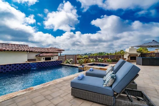 a view of a patio with couches and potted plants