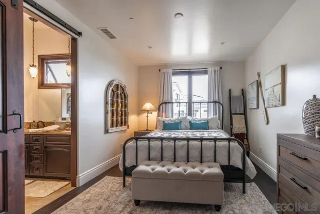 a spacious bathroom with a tub sink shower and mirror
