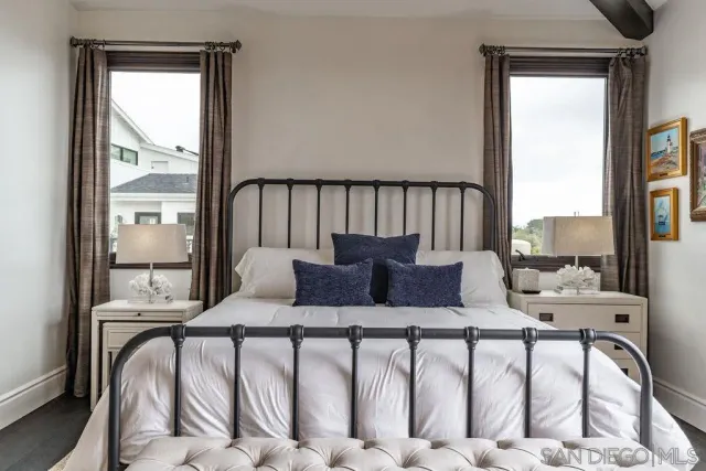a spacious bathroom with a tub sink and mirror