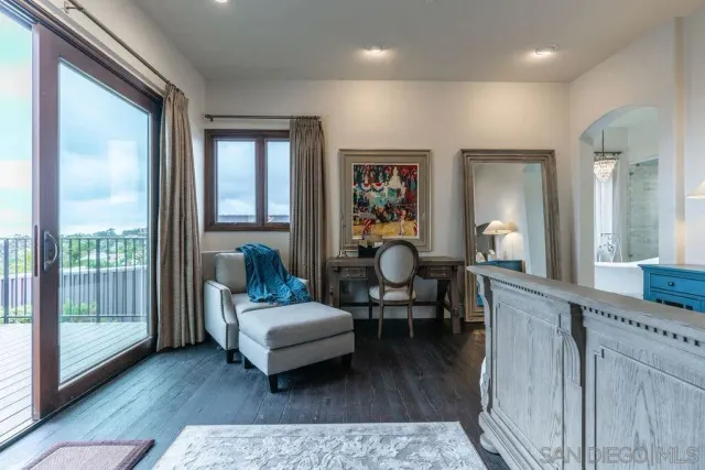 a view of a chairs and table on the wooden deck