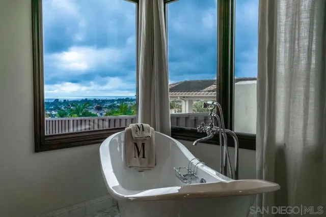 a bed room with a bed and a chair