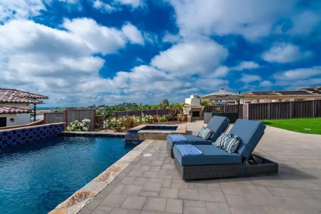 a living room with fireplace furniture and a wooden floor