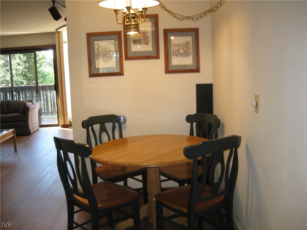 335 Ski Way, Unit 314 Incline Village, NV 89451 - Photo 7 of 15 a view of a dining room with furniture and wooden floor