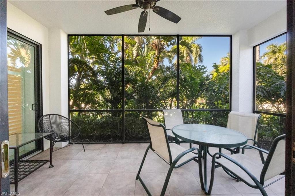 965 Sandpiper Street, Unit J107 Naples, FL 34102 - Photo 18 of 29 a view of a dining room with furniture window and outside view
