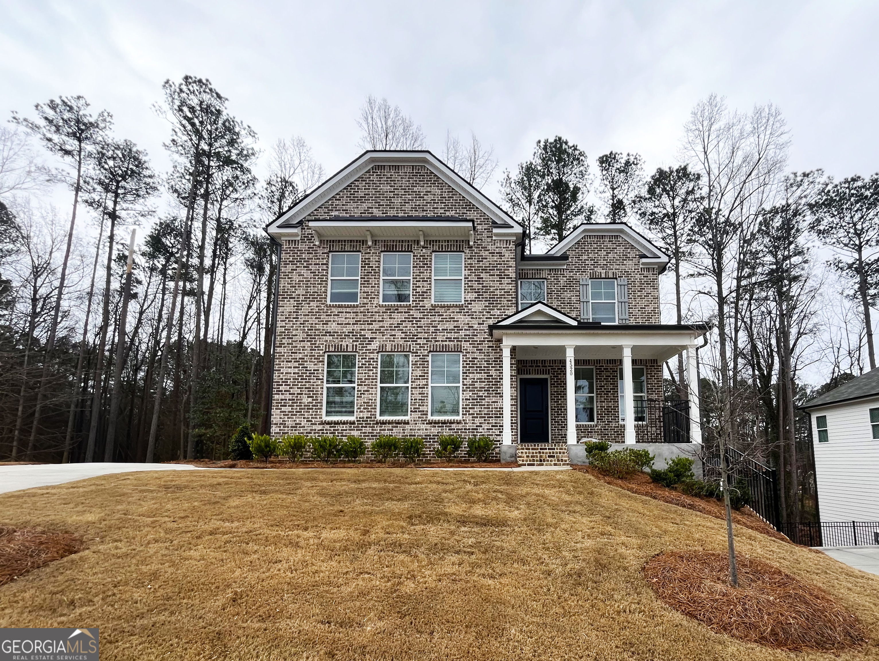 a front view of a house with a yard