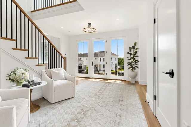 a view of a livingroom with furniture and stairs
