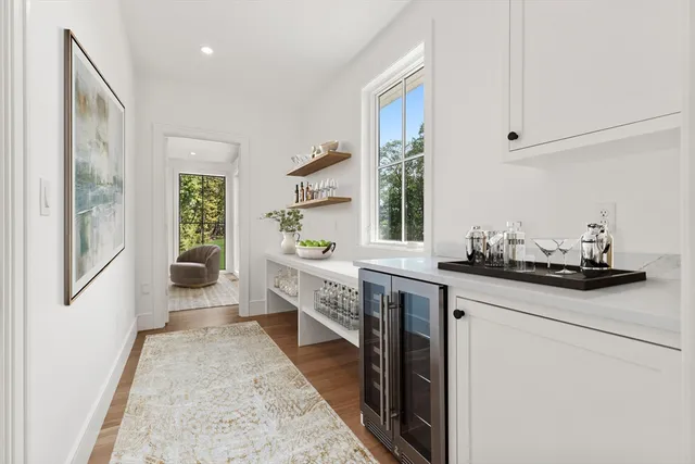 a kitchen with granite countertop a sink stove and cabinets