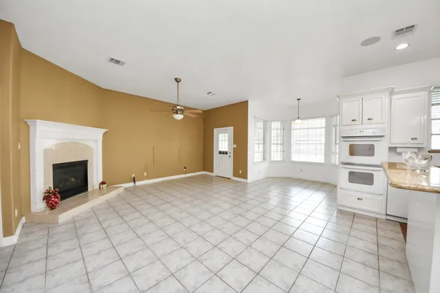 a view of a kitchen with furniture and a fireplace