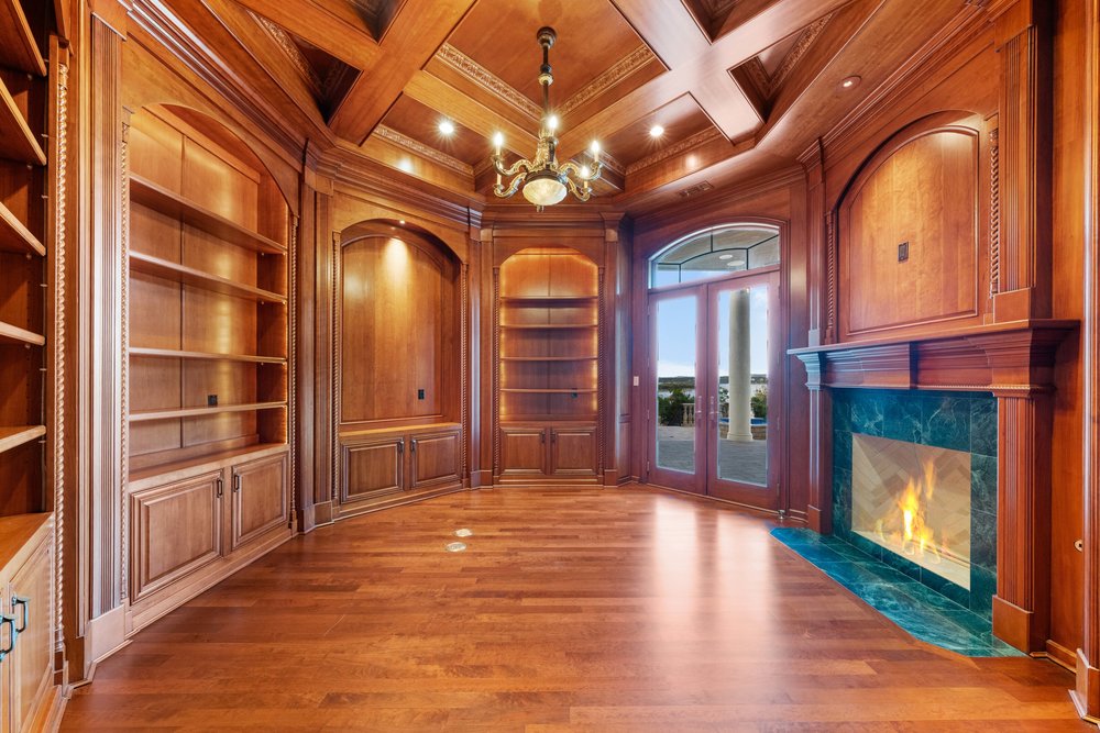 217 Bella Riva Drive Austin, TX 78734 - Photo 20 of 36 a view of a hallway with wooden floor and chandelier
