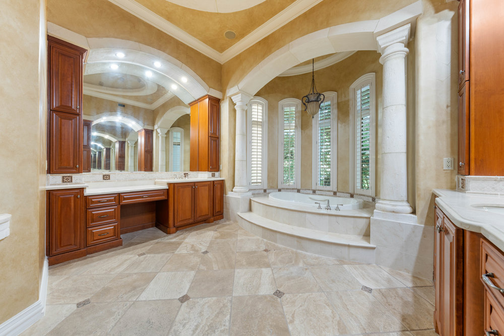 217 Bella Riva Drive Austin, TX 78734 - Photo 22 of 36 a large spacious bathroom with a large tub and sink