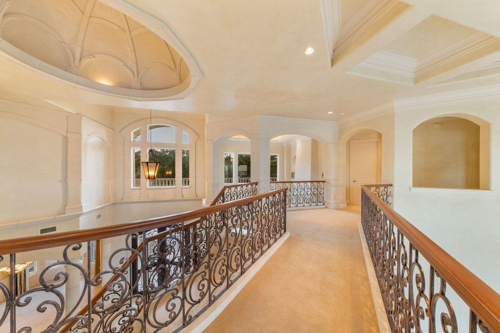 217 Bella Riva Drive Austin, TX 78734 - Photo 26 of 36 a view of a hallway with wooden floor