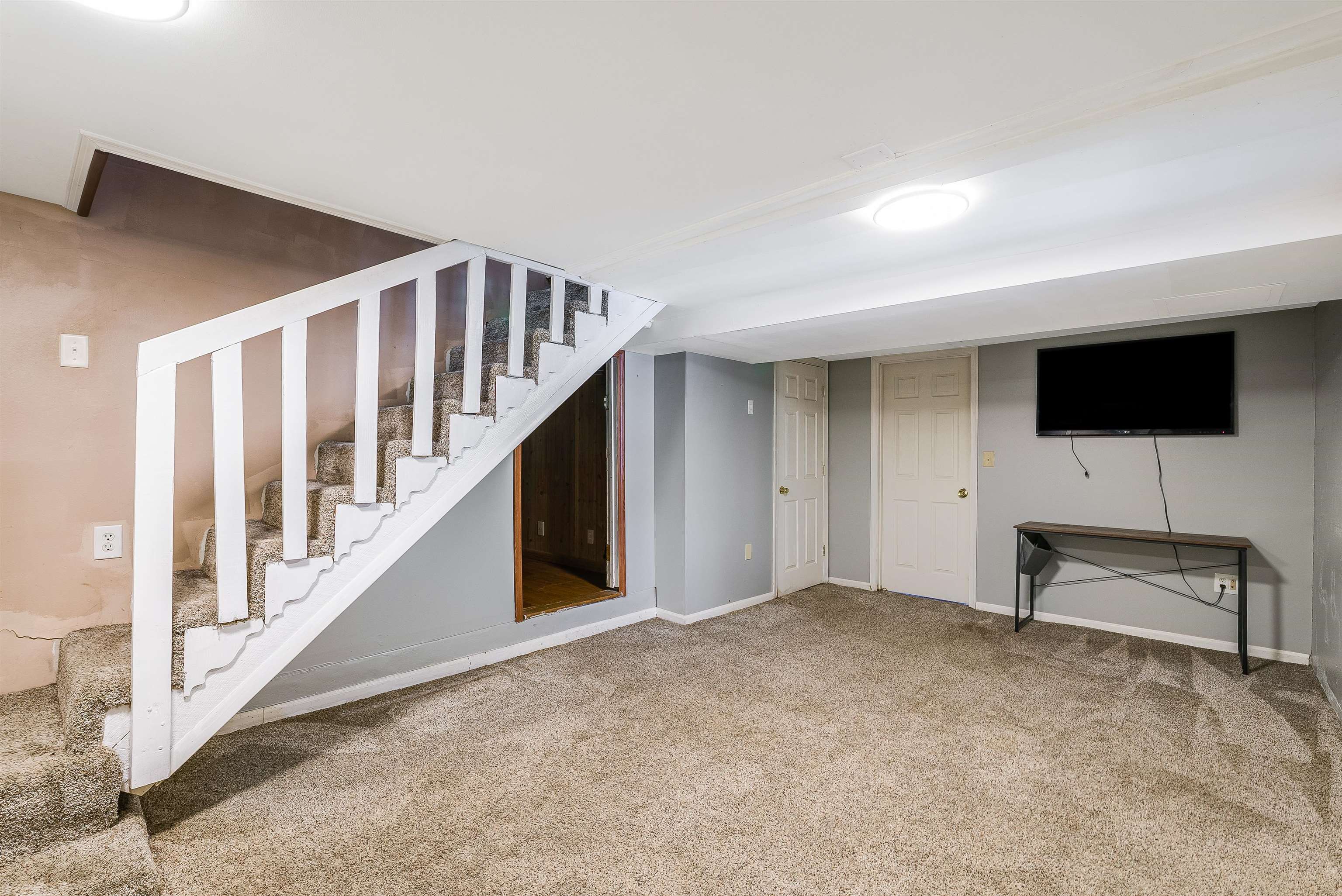 806 Randolph Street Staunton, VA 24401 - Photo 18 of 25 a view of an empty room with stairs and a window