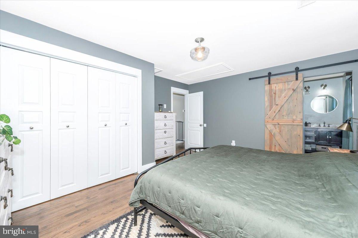 2710 Monument Road Myersville, MD 21773 - Photo 25 of 79 Modern bedroom with rustic charm.