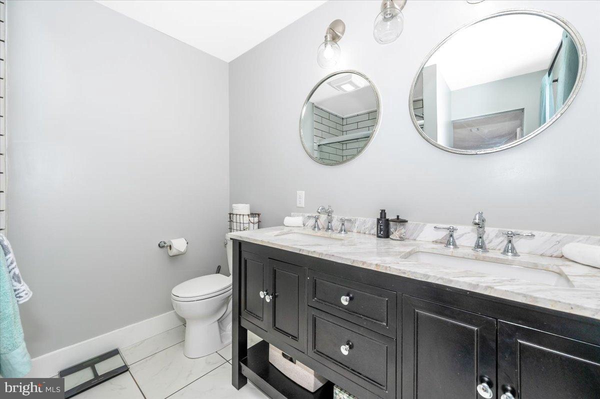 2710 Monument Road Myersville, MD 21773 - Photo 26 of 79 Sleek modern bathroom with elegant finishes.