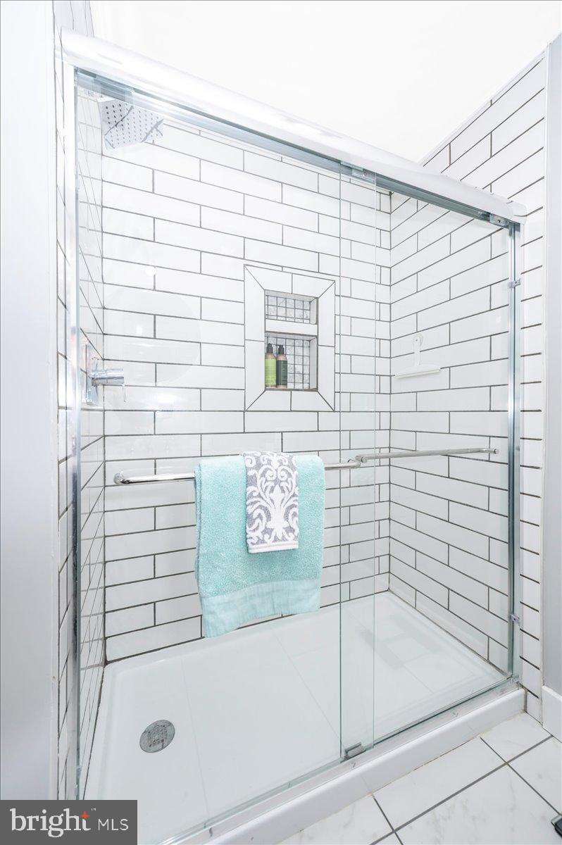 2710 Monument Road Myersville, MD 21773 - Photo 27 of 79 Sleek modern shower with elegant tiles.