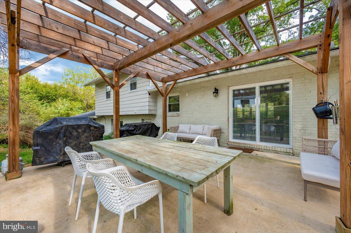 2710 Monument Road Myersville, MD 21773 - Photo 49 of 79 Charming outdoor dining space under a pergola.