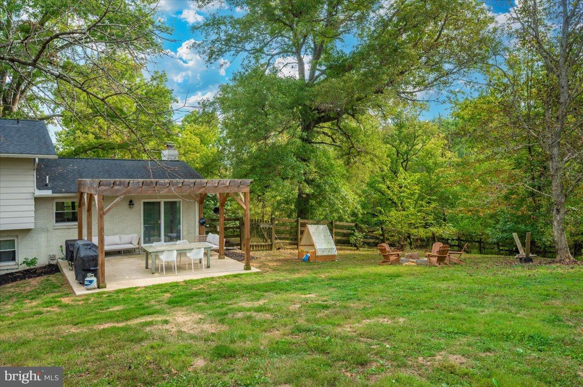 2710 Monument Road Myersville, MD 21773 - Photo 54 of 79 Serene backyard retreat with lush greenery.