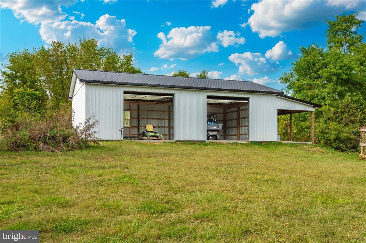 2710 Monument Road Myersville, MD 21773 - Photo 57 of 79 Spacious shed nestled in lush greenery.