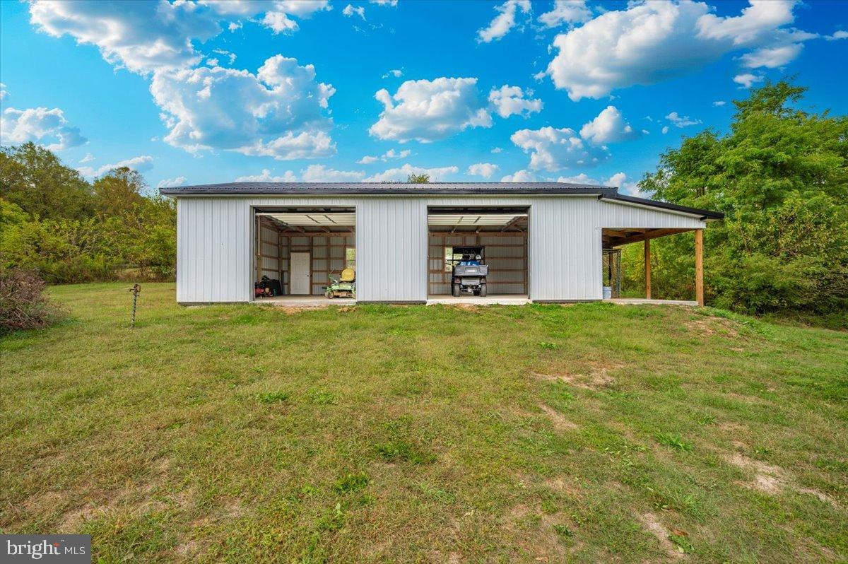 2710 Monument Road Myersville, MD 21773 - Photo 58 of 79 Spacious shed under a vibrant sky.