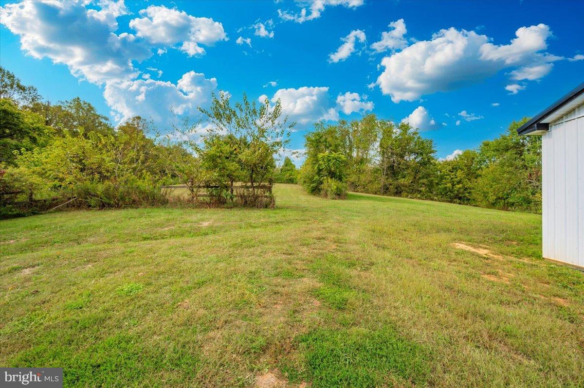 2710 Monument Road Myersville, MD 21773 - Photo 64 of 79 Spacious green expanse under a vibrant sky.