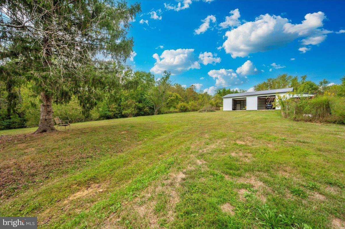 2710 Monument Road Myersville, MD 21773 - Photo 69 of 79 Serene landscape with modern home backdrop.