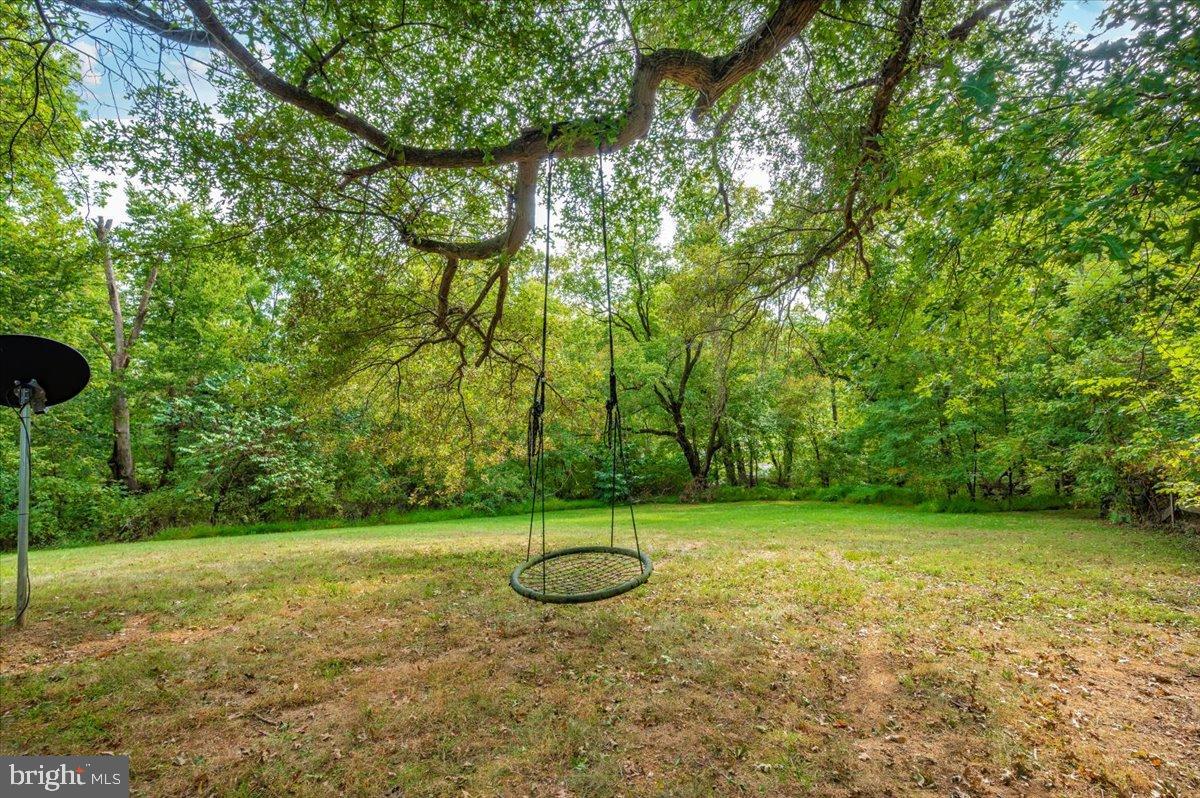 2710 Monument Road Myersville, MD 21773 - Photo 74 of 79 Serene backyard retreat with a swing.
