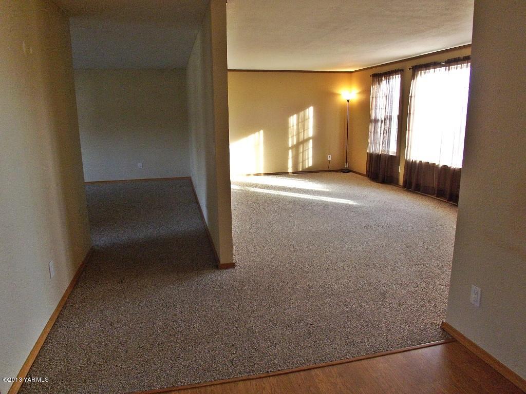17481 Summitview Road Cowiche, WA 98923 - Photo 2 of 12 an empty room with windows and entrance