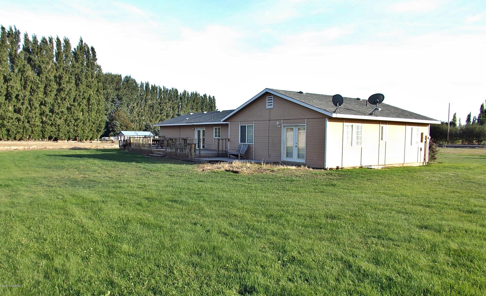 17481 Summitview Road Cowiche, WA 98923 - Photo 11 of 12 a view of a house with a backyard and a garden