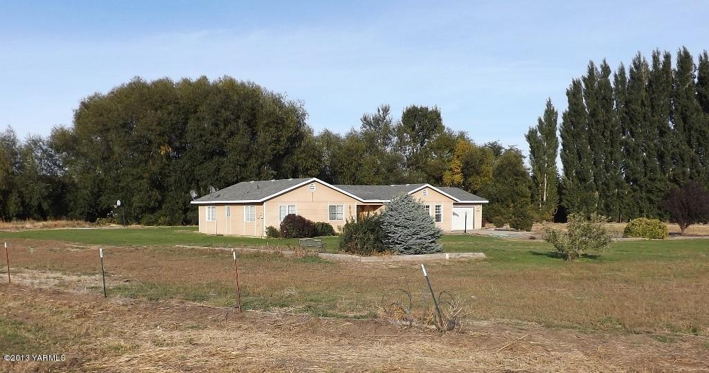 17481 Summitview Road Cowiche, WA 98923 - Photo 12 of 12 a white house that has a tree in front of it