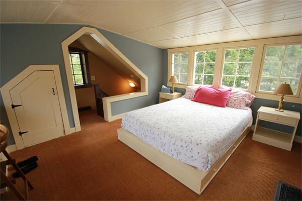 74 Ranney Corner Road Ashfield, MA 01330 - Photo 12 of 24 a bed sitting in a bedroom next to a window