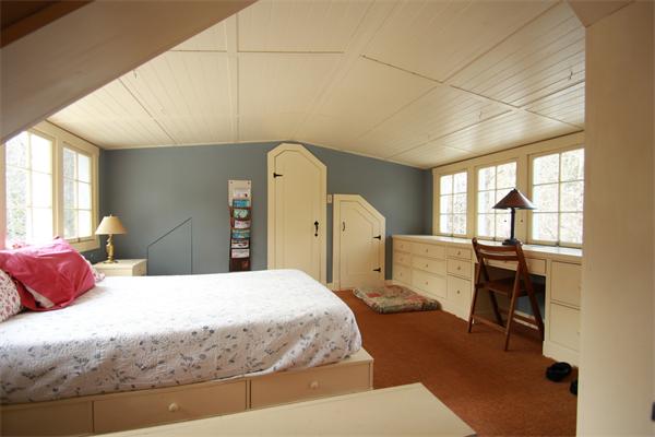 74 Ranney Corner Road Ashfield, MA 01330 - Photo 13 of 24 a bedroom with a large bed and wooden floor