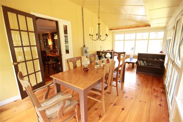 74 Ranney Corner Road Ashfield, MA 01330 - Photo 19 of 24 a view of a dining room with furniture window and wooden floor
