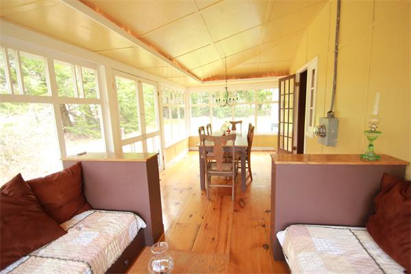 74 Ranney Corner Road Ashfield, MA 01330 - Photo 20 of 24 a living room with furniture and floor to ceiling windows