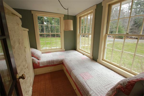74 Ranney Corner Road Ashfield, MA 01330 - Photo 10 of 24 a bedroom with a bed and a large window