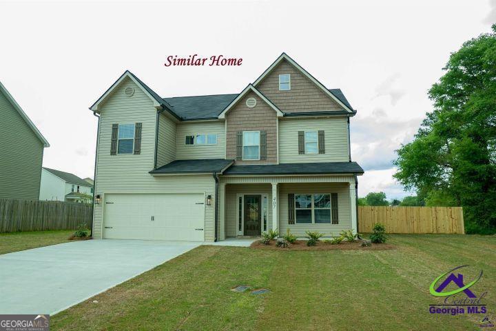 119 Bluecoat Trail Byron, GA 31008 - Photo 1 of 37 a front view of a house with a garden