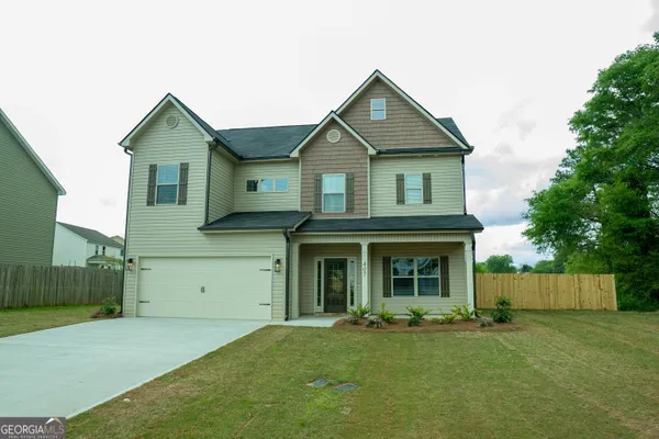 front view of a house with a yard